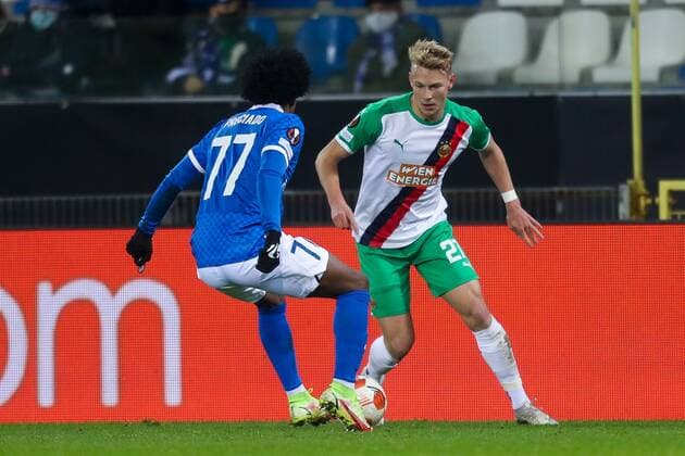 SOCCER - UEFA EL, Genk vs Rapid GENK,BELGIUM,09.DEC.21 - SOCCER - UEFA Europa League, group stage, KRC Genk vs SK Rapid Wien. Image shows Angelo Preciado (Genk) and Marco Gruell (Rapid).  GEPAxpictures xPhilippxBrem