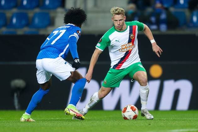 SOCCER - UEFA EL, Genk vs Rapid GENK,BELGIUM,09.DEC.21 - SOCCER - UEFA Europa League, group stage, KRC Genk vs SK Rapid Wien. Image shows Angelo Preciado (Genk) and Marco Gruell (Rapid).  GEPAxpictures xPhilippxBrem