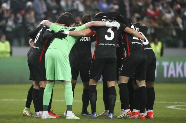 WARSAW, POLAND - DECEMBER 9, 2021: Spartakâ€™s players hug in a circle before the 2021 22 UEFA Europa League Group C Round 6 match between Spartak Moscow and Legia Warsaw at the Marshall Jozef Pilsudski s Municipal Stadium of Legia Warsaw. Alexander Demianchuk TASS  TS11B4E2