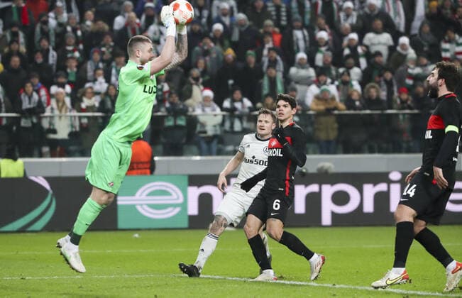 WARSAW, POLAND - DECEMBER 9, 2021: Spartak s goalkeeper Alexander Selikhov, Legia s Mattias Johansson, Spartak s Ayrton and Georgy Dzhikiya (L-R) in action in the 2021 22 UEFA Europa League Group C Round 6 match between Spartak Moscow and Legia Warsaw at the Marshall Jozef Pilsudski s Municipal Stadium of Legia Warsaw. Alexander Demianchuk TASS  TS11B4E8