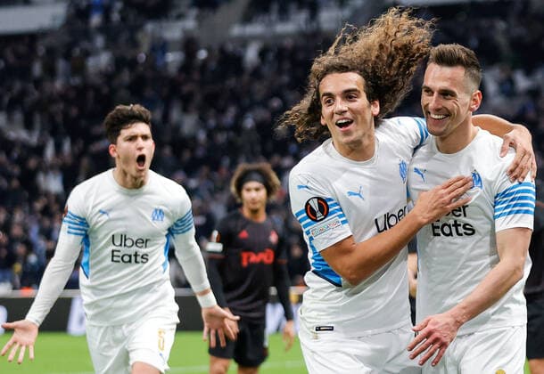 MARSEILLE, FRANCE - DECEMBER 9, 2021: Marseilleâ€™s Leonardo Balerdi, Matteo Guendouzi, and Arkadiusz Milik (L-R) celebrate a goal in the 2021 22 UEFA Europa League Group E Round 6 match between Olympique de Marseille and Lokomotiv Moscow at the Orange Velodrome Stadium. Mikhail Japaridze TASS  TS11B4EC