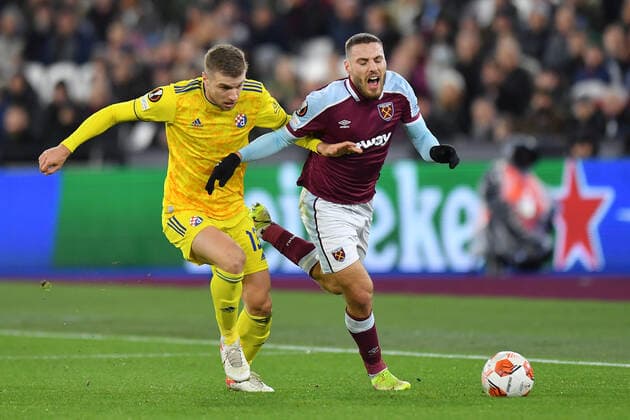Football - UEFA Europe League - Group H - Round Six - West Ham United vs Dinamo Zagreb - London Stadium - Thursday 9th December 2021. West Ham United s Nikola Vlasic is tackled by Dinamo Zagreb s Stefan Ristovski. COLORSPORT Ashley Western 