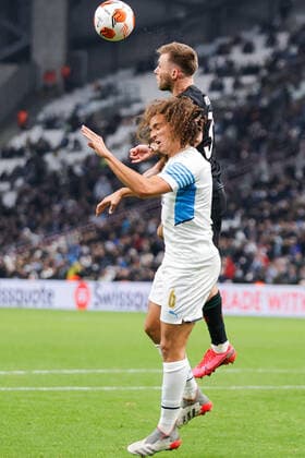 MARSEILLE, FRANCE - DECEMBER 9, 2021: Marseille s Matteo Guendouzi (L) and Lokomotivâ€™s Maciej Rybus in action in the 2021 22 UEFA Europa League Group E Round 6 match between Olympique de Marseille and Lokomotiv Moscow at the Orange Velodrome Stadium. Mikhail Japaridze TASS  TS11B4F1