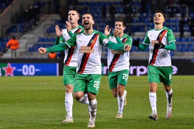 Rapid Wien s players celebrate after winning a game between Belgian soccer team KRC Genk and Austrian soccer team SK Rapid Wien, Thursday 09 December 2021, in Genk, in the group H of the Europa League group stage, on the sixth and last day. JOHANxEYCKENS  x3153107x