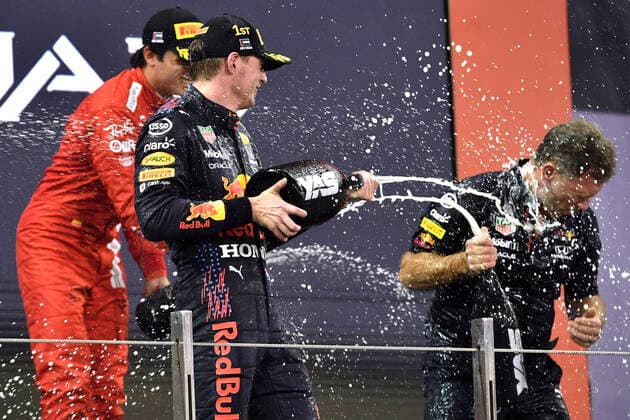 VERSTAPPEN Max F1 Team Red Bull Racing winner of Abu Dhabi 2021 and new F 1 World Champion at the presentation ceremony with HORNER Christian F1 FIA Grand Prix of Abu Dhabi 2021 on 12 12 2021 in UAE at Yas Marina Circuit