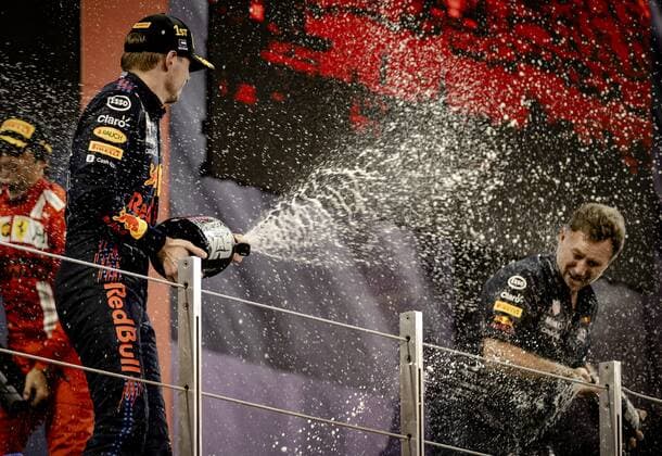 ABU DHABI Max Verstappen and Team Principal Christian Horner of Red Bull Racing on the podium after winning the Formula 1 World Championship after the Abu Dhabi Grand Prix at Yas Marina Circuit on December 12, 2021 in Abu Dhabi, United Arab Emirates REMKO DE WAAL F1 Grand Prix 2021 xVIxANPxSportx xxANPxIVx 441987301