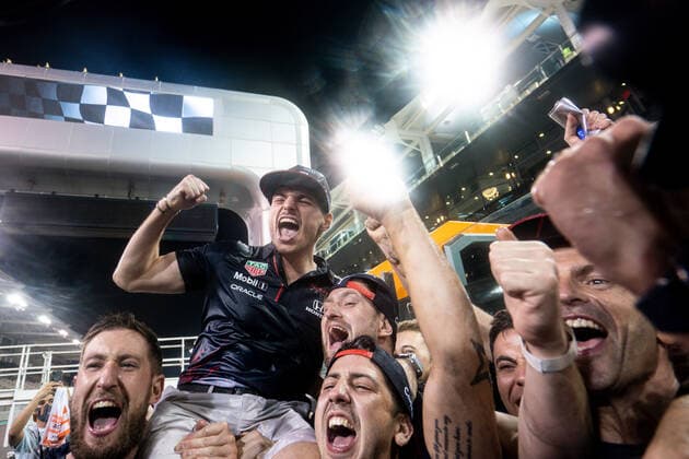 December 12, 2021, Abu Dhabi, United Arab Emirates: Dutch driver MAX VERSTAPPEN celebrates with Red Bull Racing teammates after winning the Formula One Driver s Championship with a controversial win of the Abu Dhabi Grand Prix, at Yas Marina Circuit. Abu Dhabi United Arab Emirates - ZUMAg147 20211212_mda_g147_107 Copyright: xJamesxGasperottix