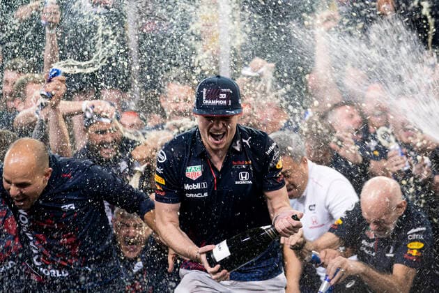 December 12, 2021, Abu Dhabi, United Arab Emirates: Dutch driver MAX VERSTAPPEN celebrates with Red Bull Racing teammates after winning the Formula One Driver s Championship with a controversial win of the Abu Dhabi Grand Prix, at Yas Marina Circuit. Abu Dhabi United Arab Emirates - ZUMAg147 20211212_zap_g147_109 Copyright: xJamesxGasperottix