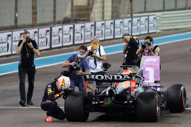 (211213) -- ABU DHABI, Dec. 13, 2021 -- Red Bull driver Max Verstappen (bottom) of the Netherlands reacts after the Formula One Abu Dhabi Grand Prix in Abu Dhabi, the United Arab Emirates, Dec. 12, 2021. Red Bull driver Max Verstappen of the Netherlands has won the world champion of 2021. (SP)UAE-ABU DHABI-F1-GRAND PRIX WuxZhuangtonglian 