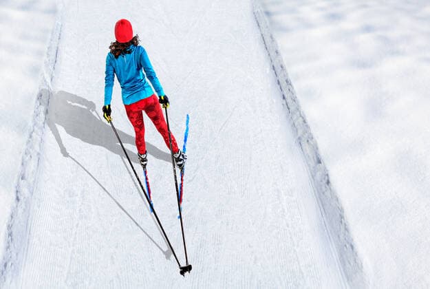 A woman cross-country skiing in the wintry forest,model released, Symbolfoto