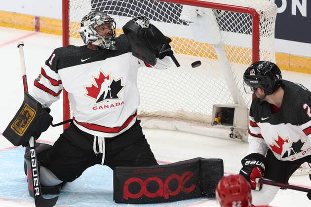 MOSCOW, RUSSIA â€“ DECEMBER 15, 2021: Canada s goaltender Justin Pogge (L) concedes a goal in their 2021 22 Euro Hockey Tour Channel One Cup Ice hockey, Eishockey match against Russia at the CSKA Arena. Valery Sharifulin TASS  TS11BE5C