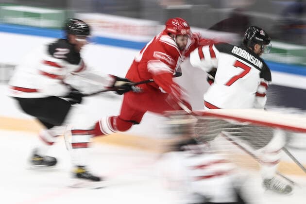 MOSCOW, RUSSIA â€“ DECEMBER 15, 2021: Canada s Brandon Gormley (L), Mat Robinson (LR) and Russia s Sergei Tolchinsky (C) in action in their 2021 22 Euro Hockey Tour Channel One Cup Ice hockey, Eishockey match at the CSKA Arena. Valery Sharifulin TASS  TS11BE68