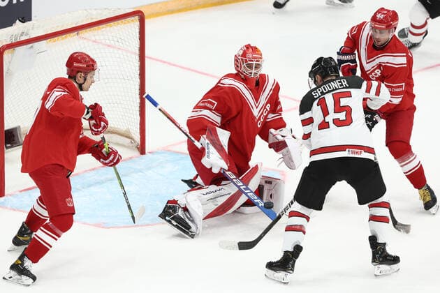MOSCOW, RUSSIA â€“ DECEMBER 15, 2021: Russia s Vadim Shipachyov, goaltender Ivan Fedotov, Yegor Yakovlev (L-R red) and Canada s Ryan Spooner (2nd R) in action in their 2021 22 Euro Hockey Tour Channel One Cup Ice hockey, Eishockey match at the CSKA Arena. Valery Sharifulin TASS  TS11BE67