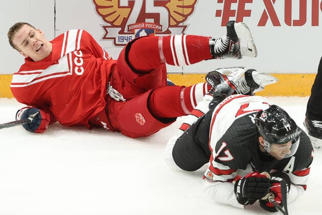 MOSCOW, RUSSIA â€“ DECEMBER 15, 2021: Russia s Pavel Karnaukhov (L) and Canada s Eric Fehr in action in their 2021 22 Euro Hockey Tour Channel One Cup Ice hockey, Eishockey match at the CSKA Arena. Valery Sharifulin TASS  TS11BE88