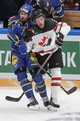 MOSCOW, RUSSIA â€“ DECEMBER 17, 2021: Swedenâ€™s Linus Johansson (L) and Canadaâ€™s Jason Demers in their national teamsâ€™ 2021 Channel One Cup Ice hockey, Eishockey match at CSKA Arena as part of the 2021 22 Euro Hockey Tour. Valery Sharifulin TASS  TS11C2A0