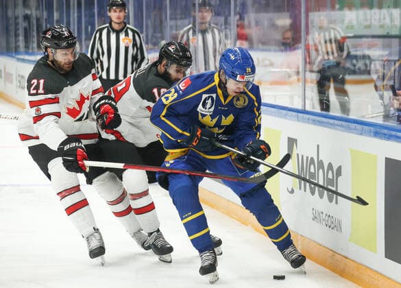 MOSCOW, RUSSIA â€“ DECEMBER 17, 2021: Canadaâ€™s Tyler Graovac, Eric O Dell and Swedenâ€™s Pontus Holmberg (L-R) in their national teamsâ€™ 2021 Channel One Cup Ice hockey, Eishockey match at CSKA Arena as part of the 2021 22 Euro Hockey Tour. Valery Sharifulin TASS  TS11C330
