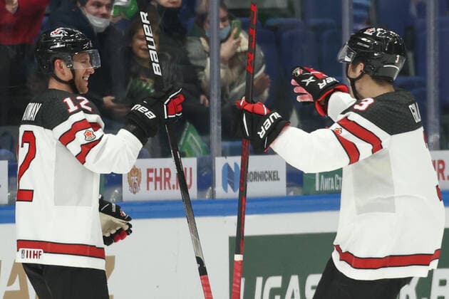 MOSCOW, RUSSIA â€“ DECEMBER 17, 2021: Canada s Charles Genoway (L) and John Gilmour celebrate a goal scored against Sweden in their national team, Nationalteam s 2021 Channel One Cup Ice hockey, Eishockey match at CSKA Arena as part of the 2021 22 Euro Hockey Tour. Valery Sharifulin TASS  TS11C333