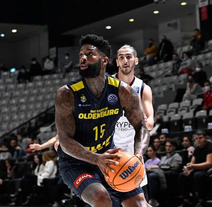 Kenan Sipahi (55) of Besiktas Icrypex and Cameron Clark (15) of Ewe Baskets Oldenburg during the FIBA Champions League group H match between Besiktas Icrypex and Ewe Baskets Oldenburg at Besiktas Akatlar Arena in Istanbul , Turkey on December 21 , 2021. ( Photo by Seskimphoto ) 