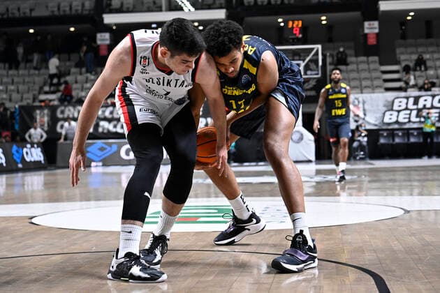 Furkan Haltali (L) of Besiktas Icrypex and Norris Agbakoko (R) of Ewe Baskets Oldenburg during the FIBA Champions League group H match between Besiktas Icrypex and Ewe Baskets Oldenburg at Besiktas Akatlar Arena in Istanbul , Turkey on December 21 , 2021. ( Photo by Seskimphoto ) 