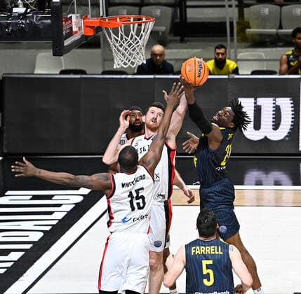Ercan Osmani (6) , Isaiah Whitehead (15) of Besiktas Icrypex and TJ Holyfield of Ewe Baskets Oldenburg during the FIBA Champions League group H match between Besiktas Icrypex and Ewe Baskets Oldenburg at Besiktas Akatlar Arena in Istanbul , Turkey on December 21 , 2021. ( Photo by Seskimphoto ) 