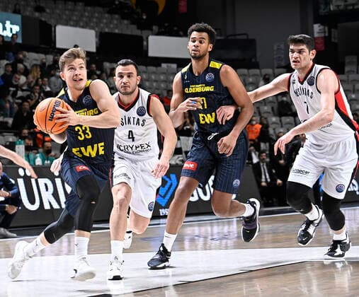 Furkan Haltali (R) , Mehmet Yagmur (4) of Besiktas Icrypex and Bennet Hundt (33) , Norris Agbakoko (17) of Ewe Baskets Oldenburg during the FIBA Champions League group H match between Besiktas Icrypex and Ewe Baskets Oldenburg at Besiktas Akatlar Arena in Istanbul , Turkey on December 21 , 2021. ( Photo by Seskimphoto ) 