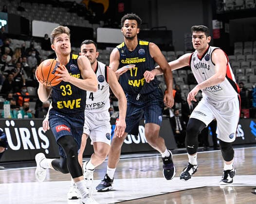 Furkan Haltali (R) , Mehmet Yagmur (4) of Besiktas Icrypex and Bennet Hundt (33) , Norris Agbakoko (17) of Ewe Baskets Oldenburg during the FIBA Champions League group H match between Besiktas Icrypex and Ewe Baskets Oldenburg at Besiktas Akatlar Arena in Istanbul , Turkey on December 21 , 2021. ( Photo by Seskimphoto ) 