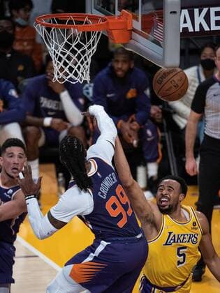 Talen Horton-Tucker 5 of the Los Angeles Lakers is blocked by Jae Crowder 99 of the Phoenix Suns during their NBA, Basketball Herren, USA game on Tuesday December 21, 2021 at the Staples Center in Los Angeles, California. Lakers vs Suns !ACHTUNG: NUR REDAKTIONELLE NUTZUNG!  Copyright: xJAVIERxROJASx GRAF982 20211222-84f52c23dd4b8f9c461b99ba9193eddbf935e0b3