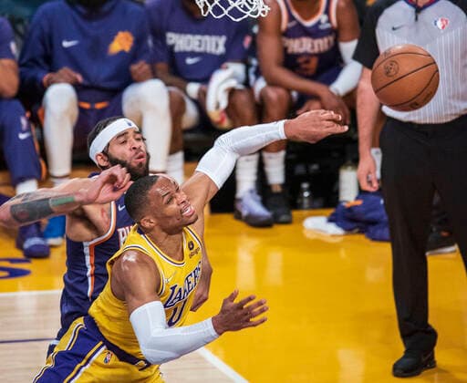 December 21, 2021, Los Angeles, California, USA: Russell Westbrook 0 of the Los Angeles Lakers is blocked by JaVale McGee 00 of the Phoenix Suns during their NBA, Basketball Herren, USA game on Tuesday December 21, 2021 at the Staples Center in Los Angeles, California. Lakers lose to Suns, 90-108. PI Los Angeles USA - ZUMAp124 20211221_zaa_p124_009 Copyright: xJAVIERxROJASx