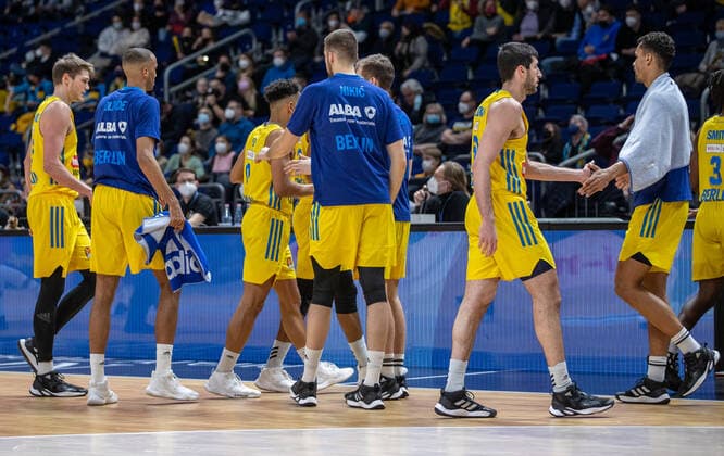 Basketball EuroLeague, ALBA Berlin AS Monaco, Matchday 17, Mercedes Benz Arena Alba Berlin players high-five each other ALBA Berlin AS Monaco