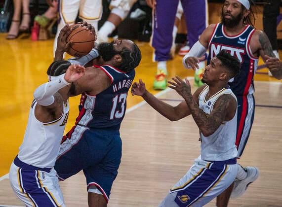 December 25, 2021, Los Angeles, California, USA: Camelo Anthony 7 of the Los Angeles Lakers stops James Harden 13 of the Brooklyn Nets as he goes for a shot during their NBA, Basketball Herren, USA home game on Saturday December 25, 2021 at Crypto.com Arena in Los Angeles, California. Lakers lose to Nets, 115-122. PI Los Angeles USA - ZUMAp124 20211225_zaa_p124_007 Copyright: xJAVIERxROJASx