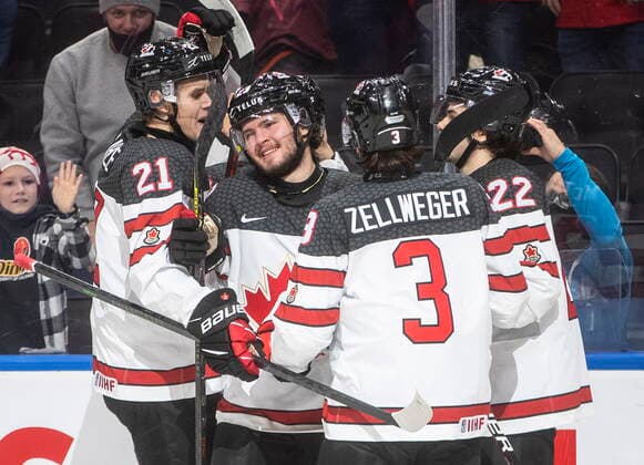 December 26, 2021, EDMONTON, AB, CANADA: Canada s Kaiden Guhle (21), Mason McTavish (23), Olen Zellweger (3) and Mavrik Bourque (22) celebrate a goal against the Czech Republic during first period IIHF World Junior Hockey Championship action in Edmonton on Sunday, December 26, 2021. Kaiden Guhle Mason McTavish Mavrik Bourque  - ZUMAc35_ 20211226_zaf_c35_083 Copyright: xJasonxFransonx