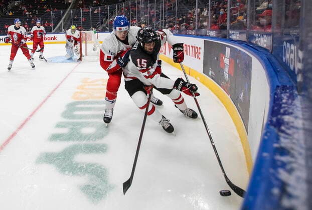 December 26, 2021, EDMONTON, AB, CANADA: Canada s Shane Wright (15) and Czech Republic s David Spacek (3) battle for the puck during first period IIHF World Junior Hockey Championship action in Edmonton on Sunday, December 26, 2021. Shane Wright David Spacek  - ZUMAc35_ 20211226_zaf_c35_080 Copyright: xJasonxFransonx