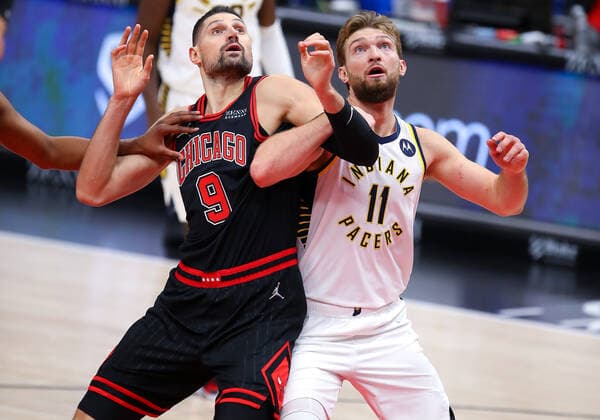 CHICAGO, IL - DECEMBER 26: Chicago Bulls Center Nikola Vucevic (9) and Indiana Pacers Forward Domantas Sabonis (11) posts up against one another during a NBA, Basketball Herren, USA game between the Indiana Pacers and the Chicago Bulls on December 26, 2021 at the United Center in Chicago, IL. (Photo by Melissa Tamez Icon Sportswire) NBA: DEC 26 Pacers at Bulls Icon2112261717