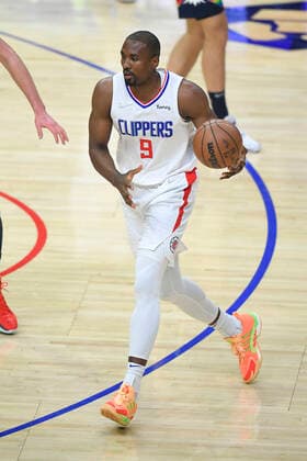 LOS ANGELES, CA - DECEMBER 26: Los Angeles Clippers center Serge Ibaka (9) brings the ball up the floor while playing the Denver Nuggets in the first half of an NBA, Basketball Herren, USA game on December 26, 2021, at Crypto.com Arena in Los Angeles, CA. (Photo by John McCoy Icon Sportswire) NBA: DEC 26 Nuggets at Clippers Icon2112260586