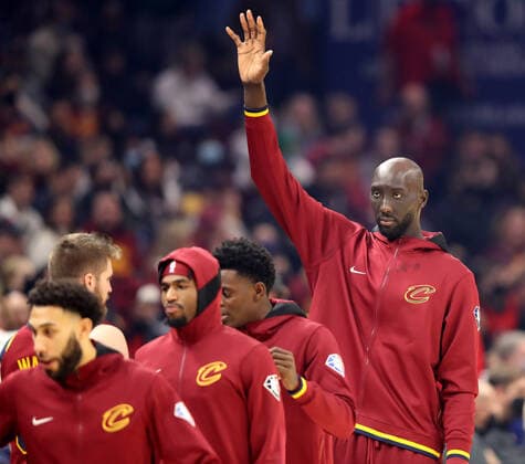 Cleveland Cavaliers Tacko Fall (99) high fives teammates prior to the Cavs game against the Toronto Raptors at Rocket Mortgage FieldHouse in Cleveland, Ohio on Sunday, December 26, 2021.  CLE20211226104 AARONxJOSEFCZYK