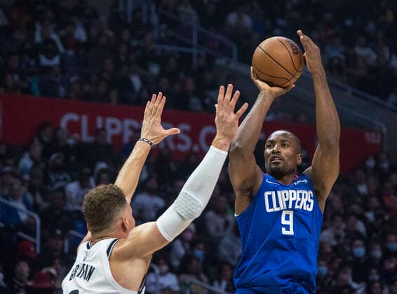 December 27, 2021, Los Angeles, California, USA: Serge Ibaka 9 of the Los Angeles Clippers puts up a shot over Blake Griffin 2 of the Brooklyn Nets during their NBA, Basketball Herren, USA game at Crypto.com Arena on Monday December 27, 2021 in Los Angeles, California. Clippers lose to Nets, 108-124. PI Los Angeles USA - ZUMAp124 20211227_zaa_p124_043 Copyright: xJAVIERxROJASx