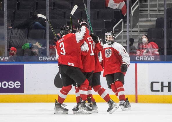 December 28, 2021, EDMONTON, AB, CANADA: Austria celebrates a goal against Canada during second period IIHF World Junior Hockey Championship action in Edmonton on Tuesday, December 28, 2021. Canada News - December 28, 2021  - ZUMAc35_ 20211228_zaf_c35_082 Copyright: xJasonxFransonx