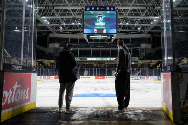 211229 Oskar Olausson and Simon Edvinsson of Sweden look out on the ice after the 2022 IIHF World Junior Championship was cancelled due to the coronavirus pandemic on December 29, 2021 in Red Deer Photo Joel Marklund BILDBYRAN kod JM JM0253 bbeng ishockey ice hockey jvm junior vm u20 2022 iihf world junior championship world juniors sverige sweden covid 19,  Copyright: JOELxMARKLUND BB211229JM055