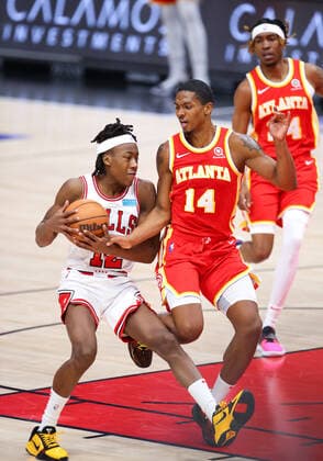 CHICAGO, IL - DECEMBER 29: Atlanta Hawks Guard Malcolm Hill (14) fouls Chicago Bulls Guard Ayo Dosunmu (12) in action during a NBA, Basketball Herren, USA game between the Atlanta Hawks and the Chicago Bulls on December 29, 2021 at the United Center in Chicago, IL. (Photo by Melissa Tamez Icon Sportswire) NBA: DEC 29 Hawks at Bulls Icon2112291414
