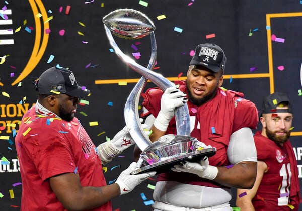 December 31, 2021: Alabama Crimson Tide offensive lineman Evan Neal (73) holds the trophy after the Cotton Bowl Classic Football Game between the University of Cincinnati Bearcats and the University of Alabama Crimson Tide at AT&T Stadium in Arlington, TX Alabama defeated Cincinnati 27-6 CSM Dallas USA - ZUMAcp2_ 20211231_zaf_cp2_023 Copyright: xAlbertxPenax