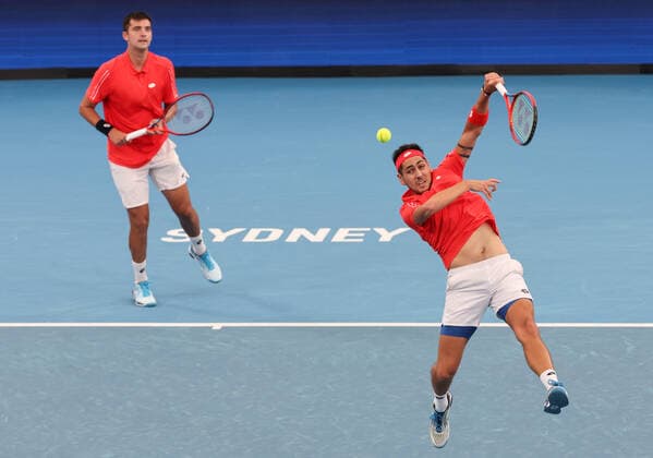 TENNIS ATP, Tennis Herren CUP, Alejandro Tabilo (R) of Team Chile hits a shot as team mate Tomas Barrios Vera watches during their doubles match against Alejandro Davidovich Fokina and Pedro Martinez of Team Spain during Day 1 of the ATP Cup tournament at Ken Rosewall Arena in Sydney, Saturday, January 1, 2022. ( NO ARCHIVING, EDITORIAL USE ONLY, NO USE IN BOOKS WITHOUT CONSENT SYDNEY NSW AUSTRALIA  Copyright: xDAVIDxGRAYx 20220101001610109307