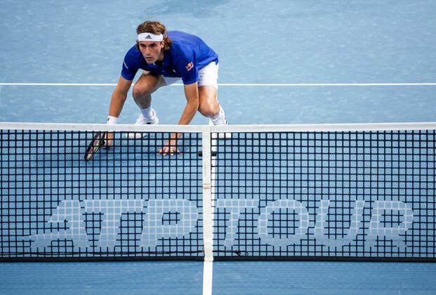 TENNIS ATP, Tennis Herren CUP, Stefanos Tsitsipas of Team Greece crouches behind the net as he plays a doubles match against Team Poland during Day 1 of the ATP Cup tournament at Ken Rosewall Arena in Sydney, Saturday, January 1, 2022. ( NO ARCHIVING, EDITORIAL USE ONLY, NO USE IN BOOKS WITHOUT CONSENT SYDNEY NSW AUSTRALIA  Copyright: xDAVIDxGRAYx 20220101001610131427