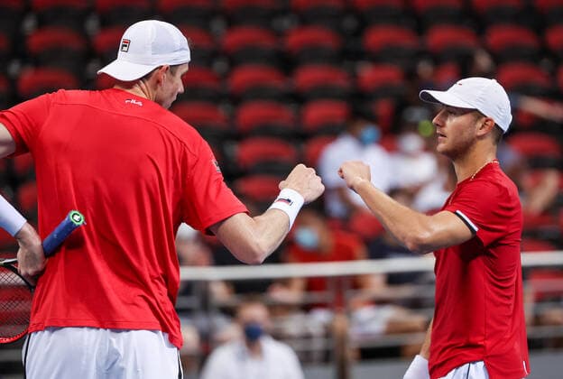 TENNIS ATP, Tennis Herren CUP, John Isner (L) of Team USA reacts with Brayden Schnur of Team Canada after winning their match on day 2 of the ATP Cup tennis tournament at Qudos Arena in Sydney, Sunday, January 2, 2022. ( NO ARCHIVING, EDITORIAL USE ONLY, NO USE IN BOOKS WITHOUT CONSENT SYDNEY NSW AUSTRALIA  Copyright: xDAVIDxGRAYx 20220102001610258505