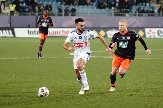 Lucas Perrin (Strasbourg) - Florent Mollet (Montpellier FC) FOOTBALL : Montpellier vs Strasbourg - 16eme de finale de coupe de France - Montpellier - 02 01 2022 NorbertScanella Panoramic 