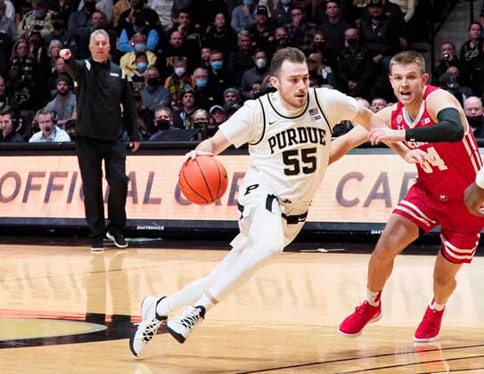 January 3, 2022: Purdue Boilermakers guard Sasha Stefanovic (55) drives the ball past Wisconsin Badgers guard Brad Davison (34) in the 1st half of the game between the Wisconsin Badgers and the Purdue Boilermakers at Mackey Arena in West Lafayette, Indiana. Mandatory Credit: Sandra Dukes CSM. West Lafayette USA - ZUMAc04_ 20220103_zaf_c04_002 Copyright: xSandraxDukes xCalxSportxMediax