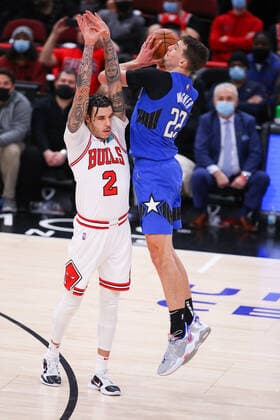 CHICAGO, IL - JANUARY 03: Chicago Bulls Guard Lonzo Ball (2) fouls Orlando Magic Forward Franz Wagner (22) who was in the process of taking a three point basket during a NBA, Basketball Herren, USA game between the Orlando Magic and the Chicago Bulls on January 3, 2022 at the United Center in Chicago, IL. (Photo by Melissa Tamez Icon Sportswire) NBA: JAN 03 Magic at Bulls Icon22010335