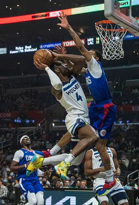 January 3, 2022, Los Angeles, California, USA: Jaylen Nowell 4 of the Minnesota Timberwolves puts a shot over Xavier Moon 15 of the Los Angeles Clippers during their NBA, Basketball Herren, USA game on Monday January 3, 2022 at Crypto.com Arena in Los Angeles, California. Clippers lose to Timberwolves, 104-122. PI Los Angeles USA - ZUMAp124 20220103_zaa_p124_004 Copyright: xJAVIERxROJASx