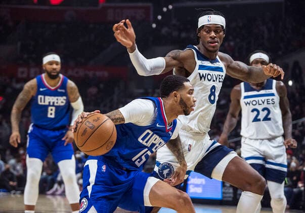 January 3, 2022, Los Angeles, California, USA: Xavier Moon 15 of the Los Angeles Clippers is is defended by Jarred Vanderbilt 8 of the Minnesota Timberwolves during their NBA, Basketball Herren, USA game on Monday January 3, 2022 at Crypto.com Arena in Los Angeles, California. Clippers lose to Timberwolves, 104-122. PI Los Angeles USA - ZUMAp124 20220103_zaa_p124_009 Copyright: xJAVIERxROJASx