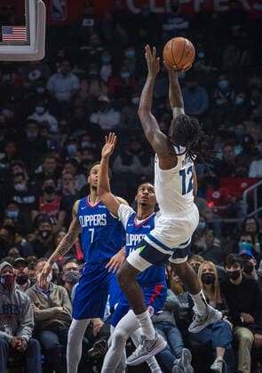 January 3, 2022, Los Angeles, California, USA: Taurean Prince 12 of the Minnesota Timberwolves puts a shot over Keon Johnson 45 of the Los Angeles Clippers during their NBA, Basketball Herren, USA game on Monday January 3, 2022 at Crypto.com Arena in Los Angeles, California. Clippers lose to Timberwolves, 104-122. PI Los Angeles USA - ZUMAp124 20220103_zaa_p124_014 Copyright: xJAVIERxROJASx