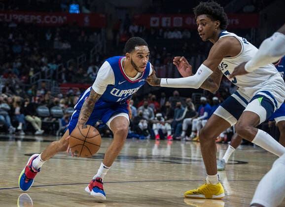 January 3, 2022, Los Angeles, California, USA: Xavier Moon 15 of the Los Angeles Clippers is defended by Jaden McDaniels 3 of the Minnesota Timberwolves during their NBA, Basketball Herren, USA game on Monday January 3, 2022 at Crypto.com Arena in Los Angeles, California. Clippers lose to Timberwolves, 104-122. PI Los Angeles USA - ZUMAp124 20220103_zaa_p124_019 Copyright: xJAVIERxROJASx